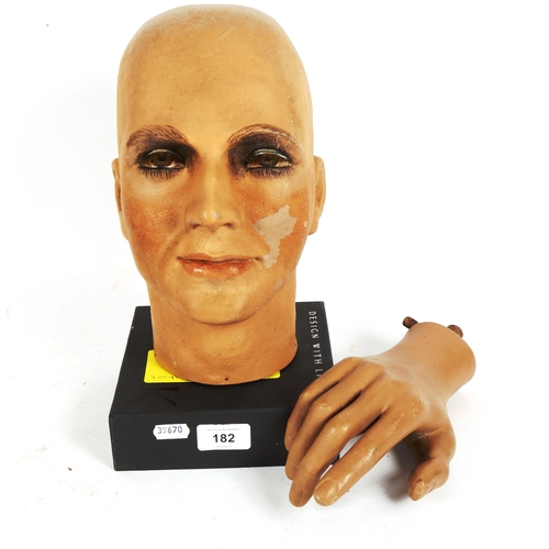 182 - A hand painted composition mannequin head, by Sperling Models Ltd, and a mannequin hand