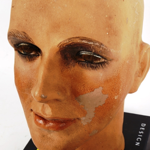 182 - A hand painted composition mannequin head, by Sperling Models Ltd, and a mannequin hand