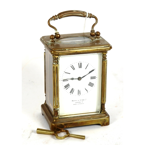 191 - A Mappin & Webb brass-cased carriage clock, white enamel dial with Roman numeral hour markers, case ... 