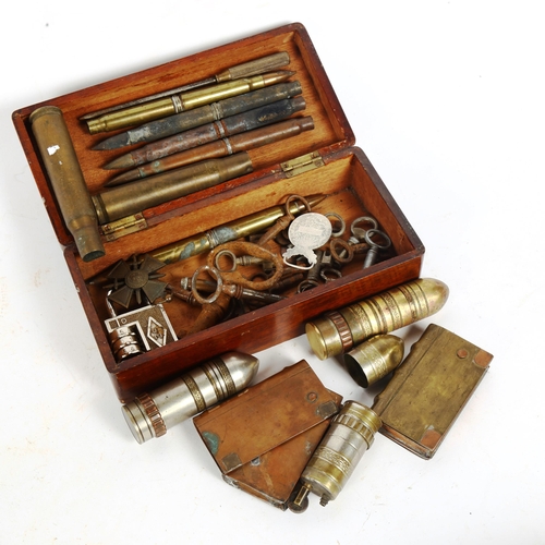 211 - Trench art, bullet shell cases, SOS 35 combination padlock and bullet case cigarette lighters / ciga... 