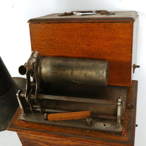 231 - An early 20th century oak wax cylinder player, with original tin horn (case top detached)