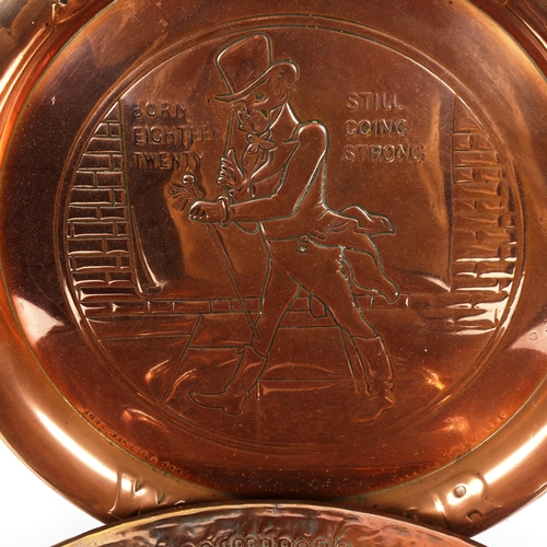 234 - A Middle Eastern copper charger, and a similar Johnnie Walker advertising example, largest diameter ... 