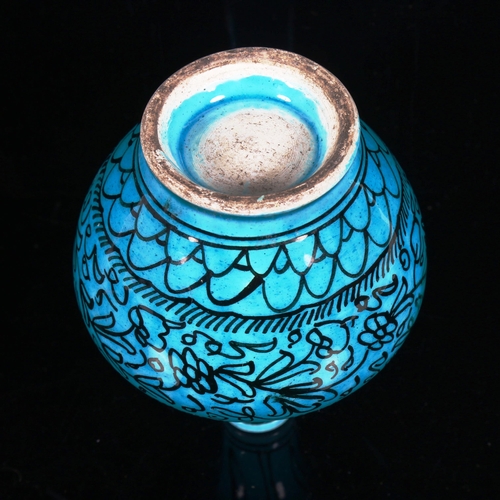 244 - A Middle Eastern Iznik turquoise glaze ceramic narrow-neck vase, with hand painted decoration, heigh... 