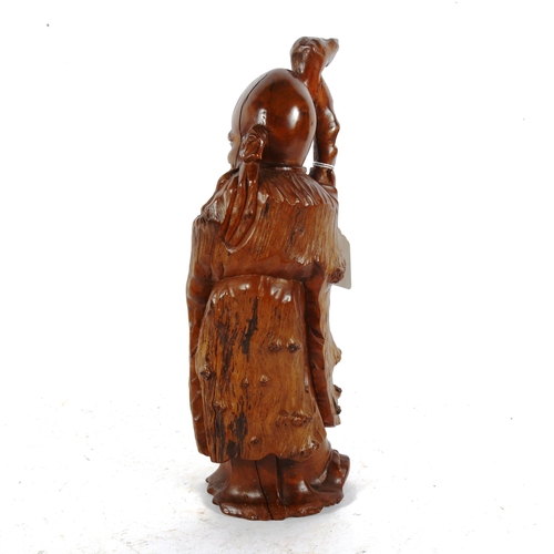 251 - A Chinese carved hardwood Shou Lao figure, height 32cm