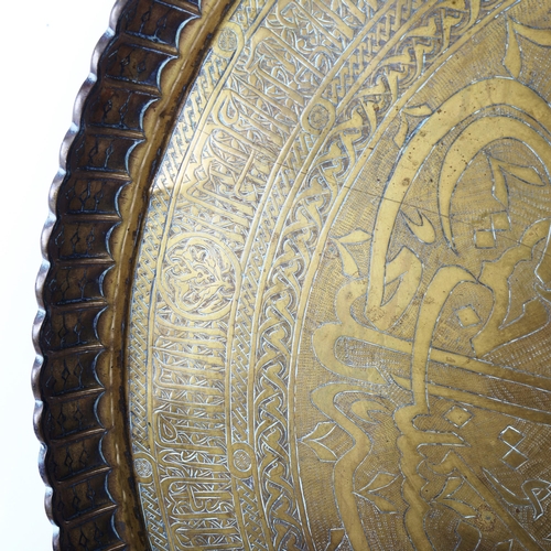 417 - A large Middle Eastern brass pie crust tray, diameter 63cm