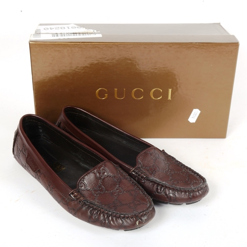 65 - GUCCI - a pair of near-new chocolate leather soft Guccissima women's driver loafers, size 37.5, with... 