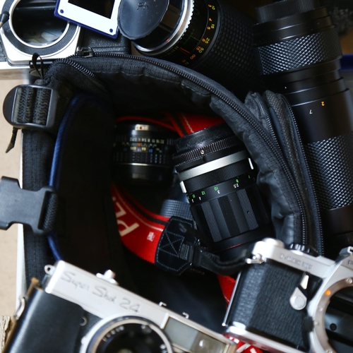 80 - Various Vintage cameras and accessories, including Praktica MTL3, Pentax ME Super, and various lense... 