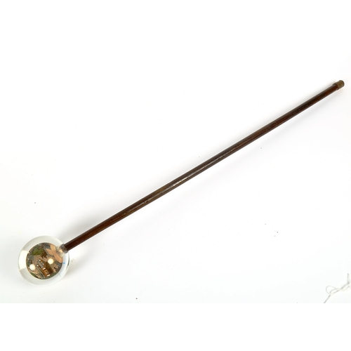 85 - A Chinese walking stick with internally painted glass globe handle, handle diameter approx 7.5cm