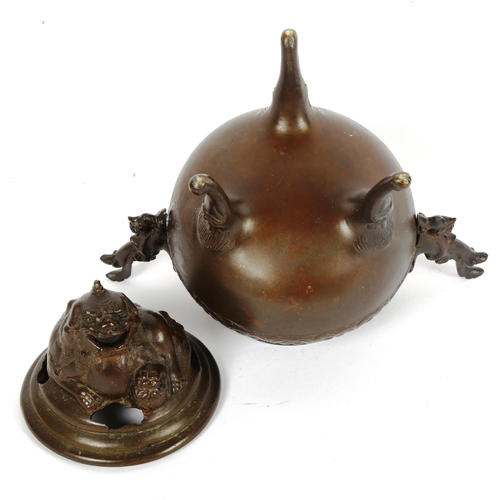 89 - A Chinese patinated bronze incense burner and cover, height 19cm