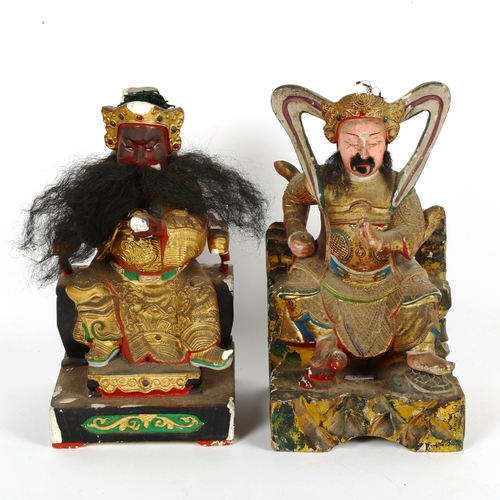 90 - A pair of Chinese painted composition seated Emperor figures, height 26cm