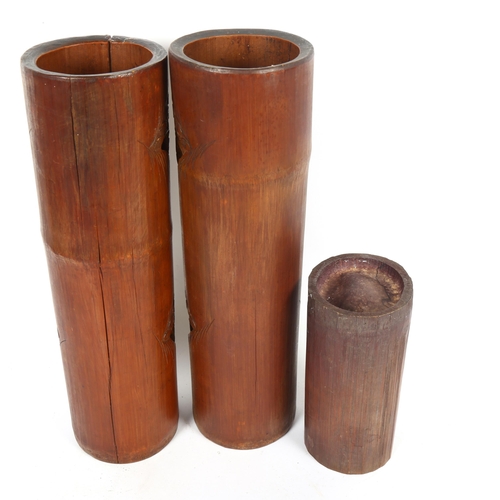 91 - A large pair of Chinese bamboo vases, and a smaller bamboo brush pot, largest height 36cm (3)