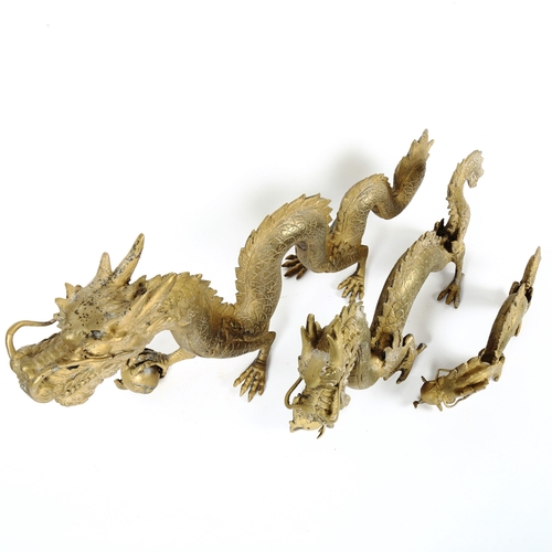 92 - A graduated set of 3 Imperial Chinese brass dragon and pearl figures, largest length 50cm (3)