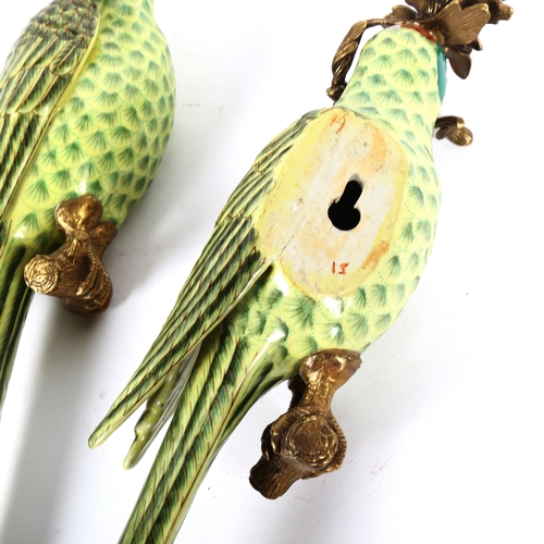 94 - A pair of porcelain parrot candle sconces, with gilt-brass mounts, height 48cm