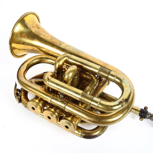 98 - A brass 3 valve pocket trumpet, in hardshell carrying case