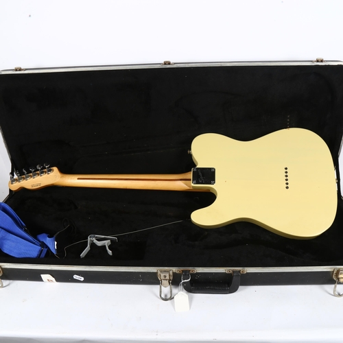 315 - A cream Fender Squier electric guitar, in hardshell travel case