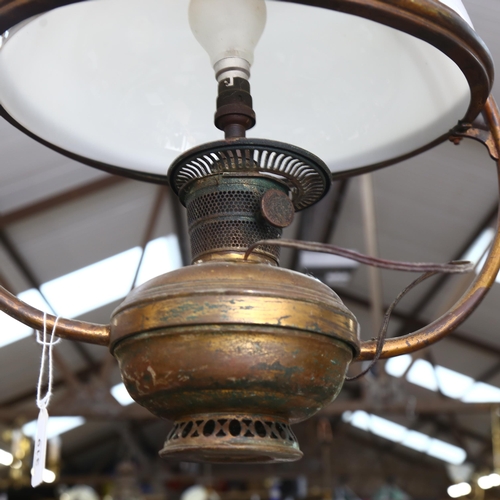 319 - A brass ceiling oil lamp converted to electric, with milk glass shade, height 85cm, and another ceil... 