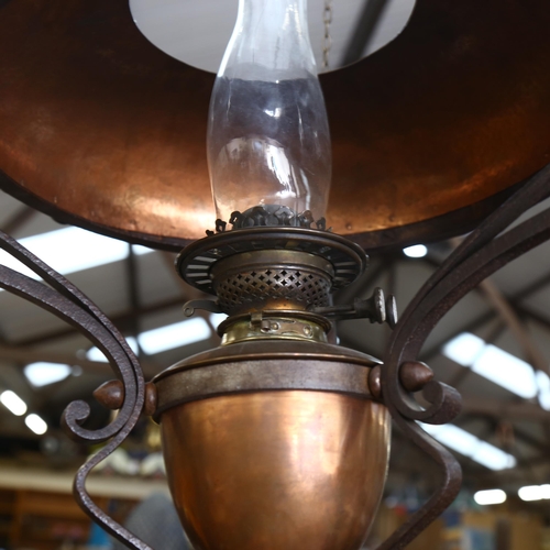 320 - A Duplex wrought-iron and copper ceiling oil lamp, height 90cm