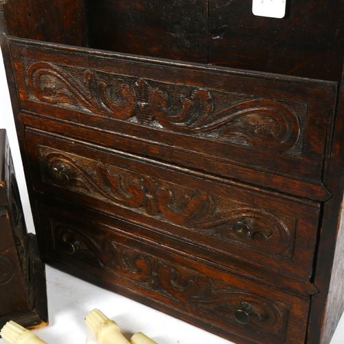 433 - A painted carved wood box and contents, length 49cm, and a carved wall cabinet with 3 drawers, havin... 