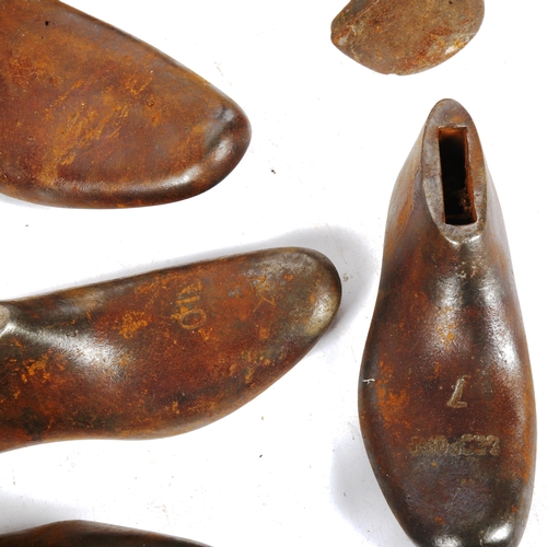 440 - A collection of Antique polished iron shoe lasts, and a boot last