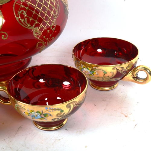 447 - A gilded ruby glass punch bowl and 5 matching cups