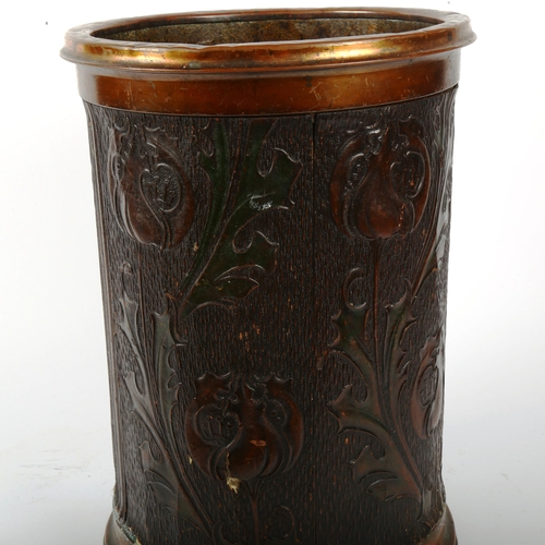 454 - A copper-bound Arts and Crafts bin, with stylised Art Nouveau decoration, height 35cm