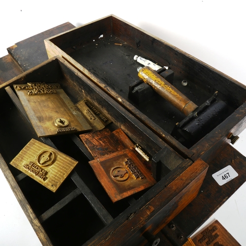 467 - A metal-bound cabinet containing tools and engraved copper plates