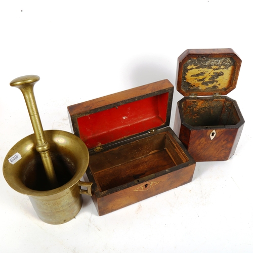 497 - A brass pestle and mortar, a 19th century tea caddy lacking fittings, height 12.5cm, and a dome-top ... 