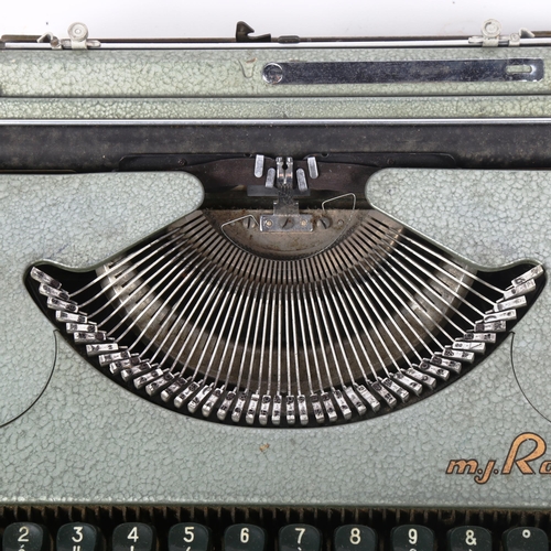 503 - A Vintage metal typewriter by M J Rooy, in fitted metal case