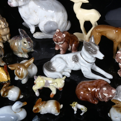 513 - A group of porcelain animals, including rabbits and dogs