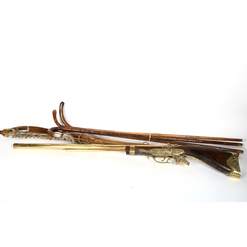 532 - A replica rifle, a lacrosse stick, and 4 walking sticks including silver-mounted