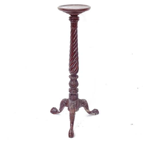 2054 - A Victorian mahogany torchere stand, on spiral turned column and tripod base, with allover carved de... 