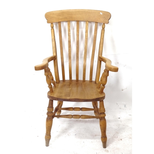 2055 - A Victorian elm-seated Windsor kitchen armchair (WITH THE OPTION TO PURCHASE THE FOLLOWING LOT)