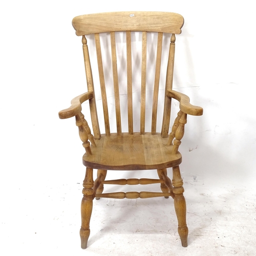 2056 - A Victorian elm-seated Windsor kitchen armchair