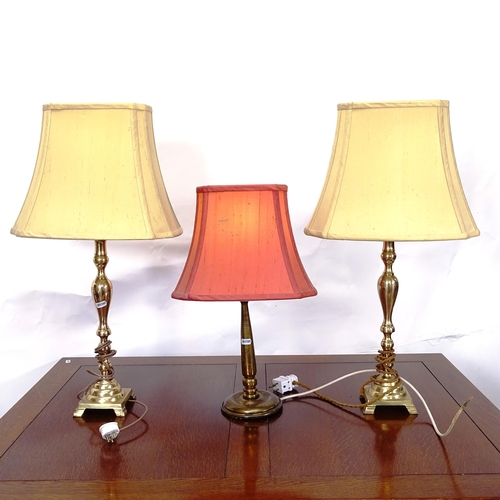 2063 - A pair of brass table lamps, height overall 65cm, and another (3)