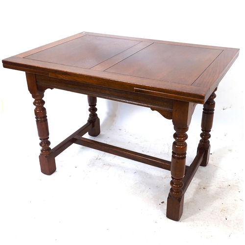 2064 - A rectangular oak draw leaf table, on turned legs with H-shaped stretcher, L107cm extending to 167cm... 