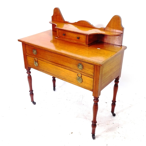 2069 - An early 20th century mahogany dressing table, W92cm, H103cm, D47cm