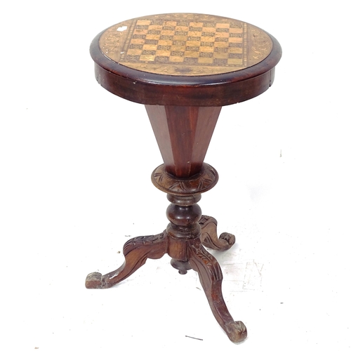 2080 - A Victorian mahogany trumpet work table, with games top and fitted interior, on tripod base, diamete... 