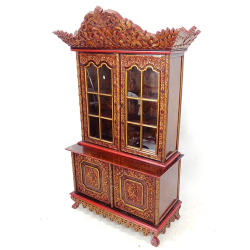 2090 - A Chinese relief carved and painted hardwood 2-section cabinet, W110cm, H173cm, D45cm