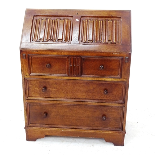 2102 - A reproduction linenfold carved and panelled oak bureau, with fitted interior and 4 drawers, W77cm, ... 