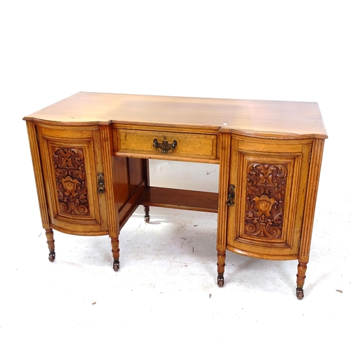 2104 - An early 20th century carved walnut kneehole writing desk, with single drawer and 2 carved doors