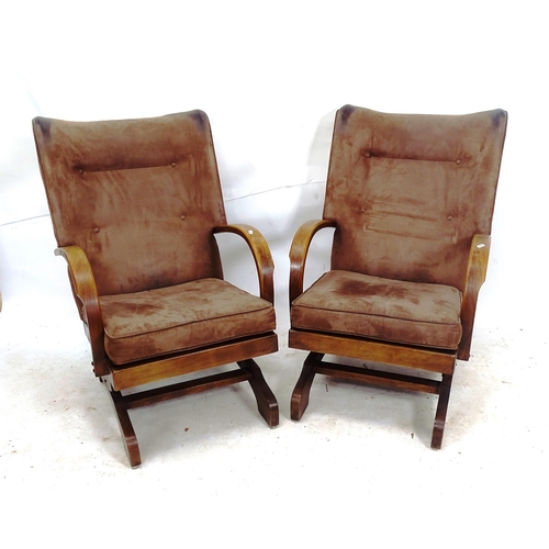 2112 - A pair of mid-century suede upholstered rocking chairs