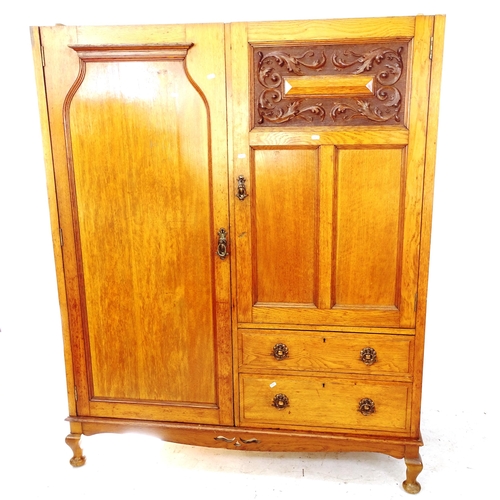 2114 - A Victorian walnut Beaconsfield wardrobe, with 2 panelled doors and relief carved decoration, and 2 ... 