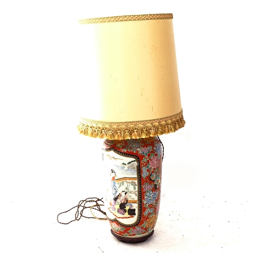 2115 - A large Chinese ceramic lamp with painted decoration, with stand and shade, height overall 90cm