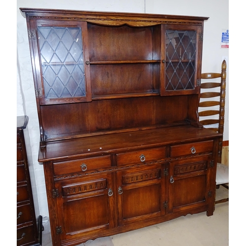 2116 - A modern carved and panelled oak 2-section dresser, base fitted with drawers and cupboards, on stile... 