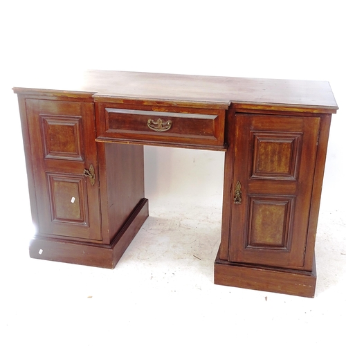 2117 - An early 20th century mahogany break-front kneehole writing table, with single drawer and 2 cupboard... 