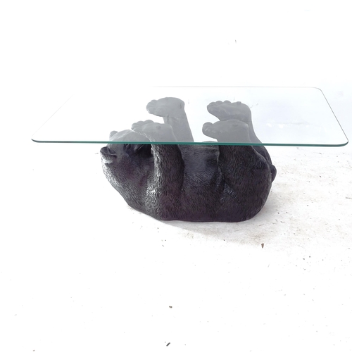 2120 - A coffee table with black bear sculpted plaster base, with rectangular glass top, L105cm, H41cm, D65... 