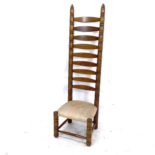 2125 - A mid-century tall ladder-back chair, in the manner of Charles Dudouyt