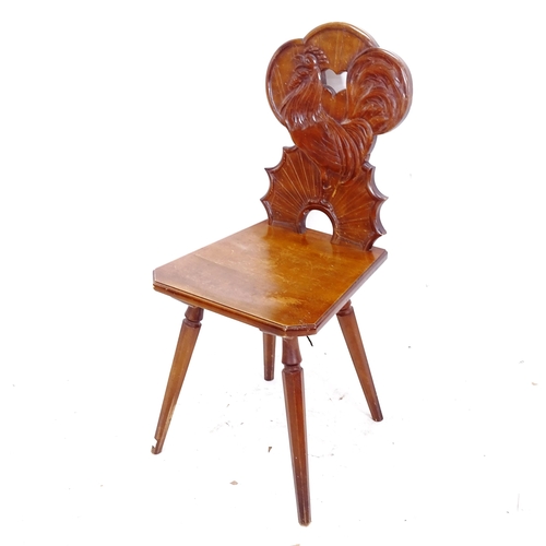 2273 - A Hans Thoma Tyrolean chair, with ornate carved back featuring a cockerel, with carved HTh monogram,... 