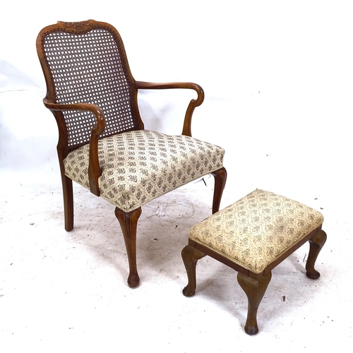 2275 - A Continental cane-backed open armchair, with similar footstool (2)