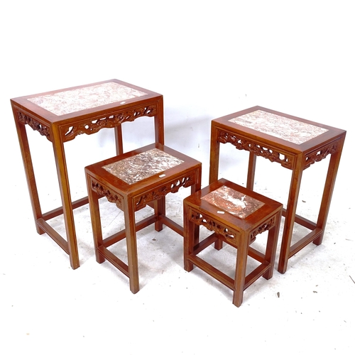 2283 - An Oriental rectangular marble-top nest of 4 occasional tables, with carved pierced frieze, widest 5... 